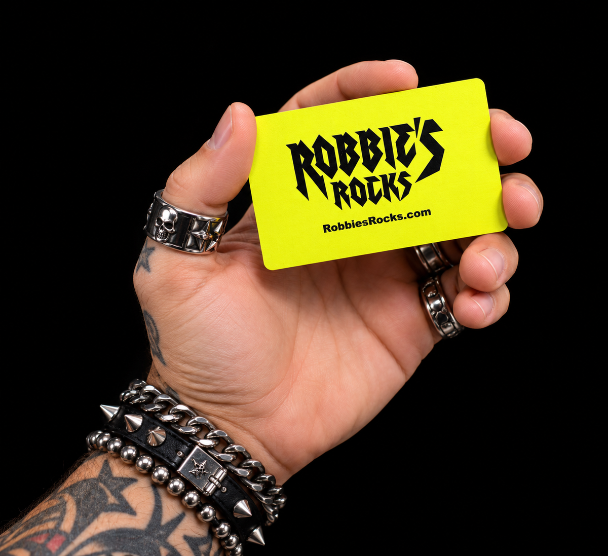 Hand holding a Robbie's Rocks gift card